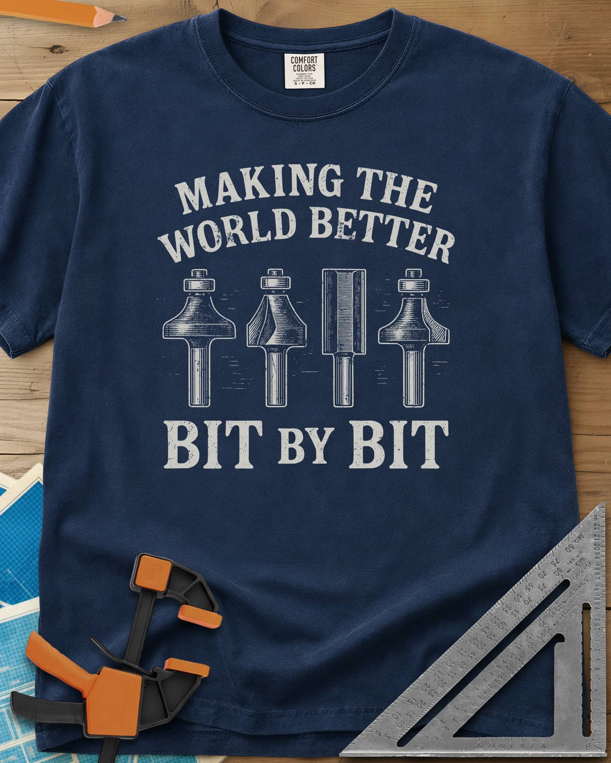 Bit by Bit heavyweight tee in Navy, four engraved-style router bits between two lines of lettering