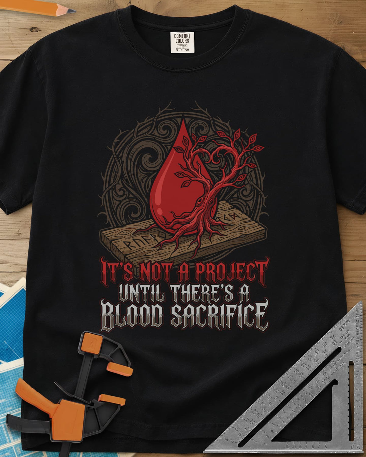 Blood Sacrifice heavyweight tee in Black, a blood drop and bare tree on a rune-carved board, gothic lettering