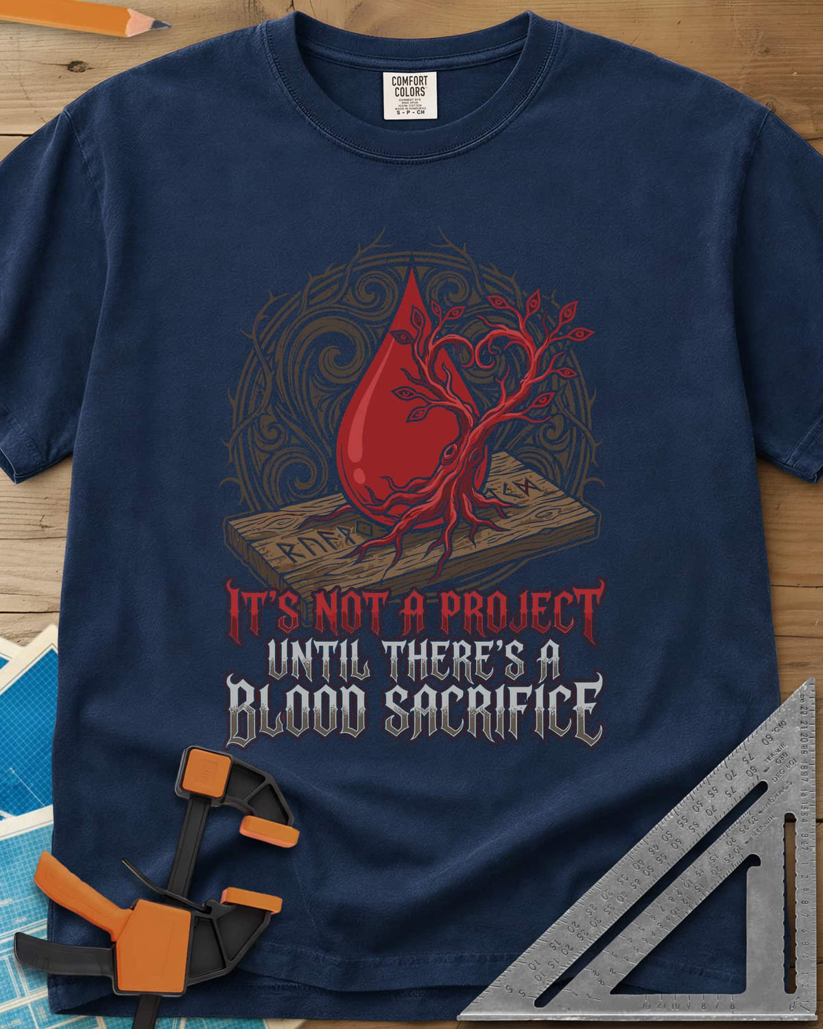 Blood Sacrifice heavyweight tee in Navy, a blood drop and bare tree on a rune-carved board, gothic lettering