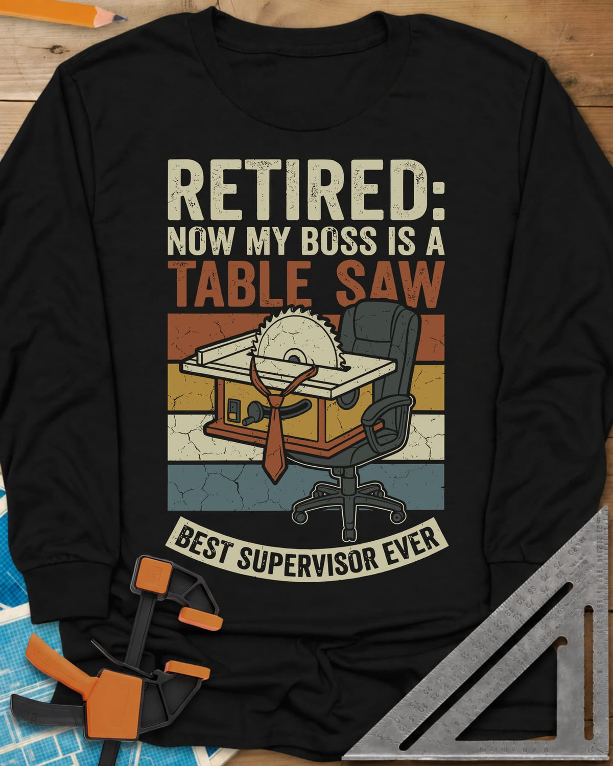 Boss Is a Table Saw long sleeve shirt in Black, a table saw in a necktie beside an empty office chair