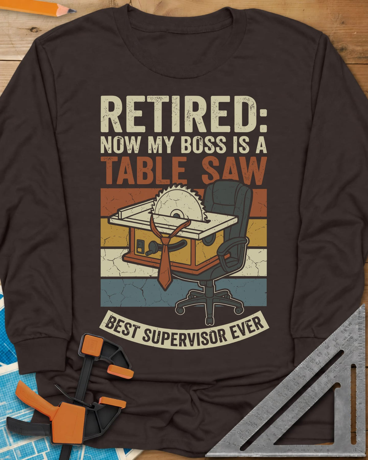Boss Is a Table Saw long sleeve shirt in Dark Chocolate, a table saw in a necktie beside an empty office chair