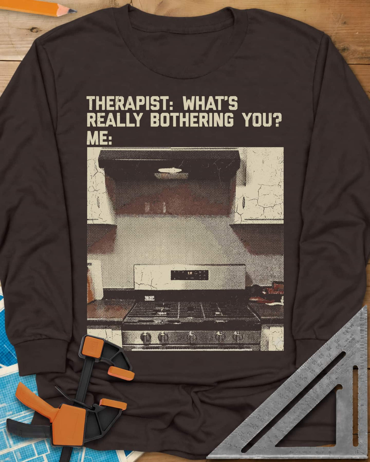 Bothering You? long sleeve shirt in Dark Chocolate, a grainy halftone photo of a kitchen stove under its range hood