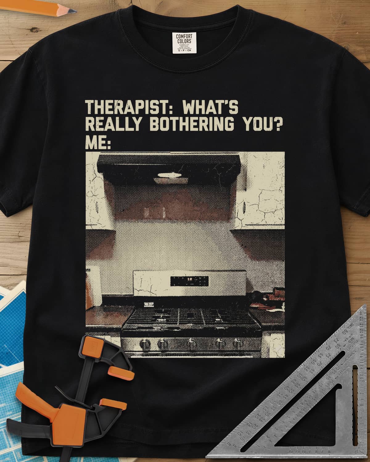 Bothering You? heavyweight tee in Black, a grainy halftone photo of a kitchen stove under its range hood