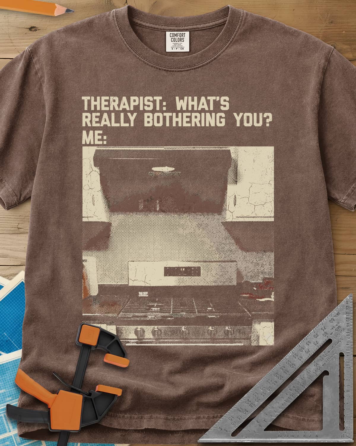 Bothering You? heavyweight tee in Espresso, a grainy halftone photo of a kitchen stove under its range hood