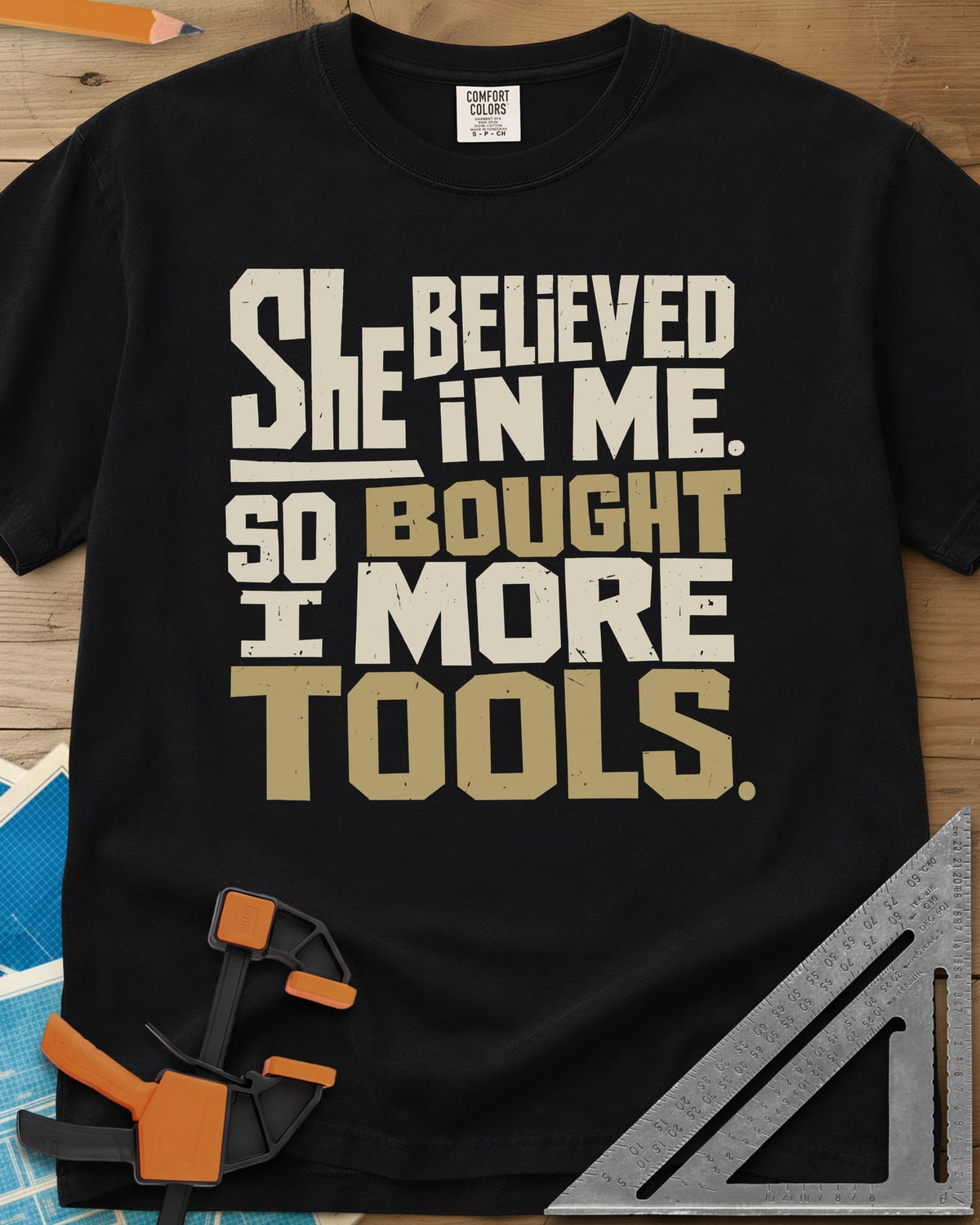 Bought More Tools heavyweight tee in Black, stacked block lettering in cream and tan, no graphic