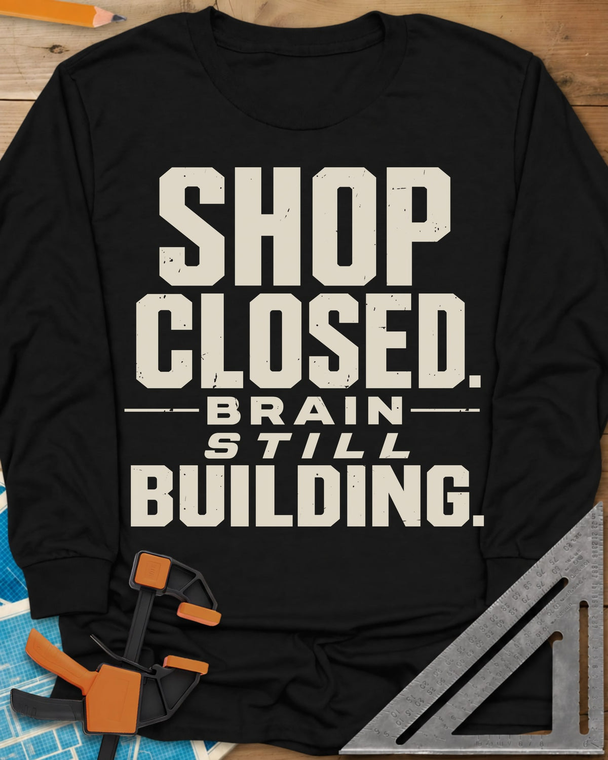 Brain Building long sleeve shirt in Black, stacked block lettering with STILL in italics, no graphic
