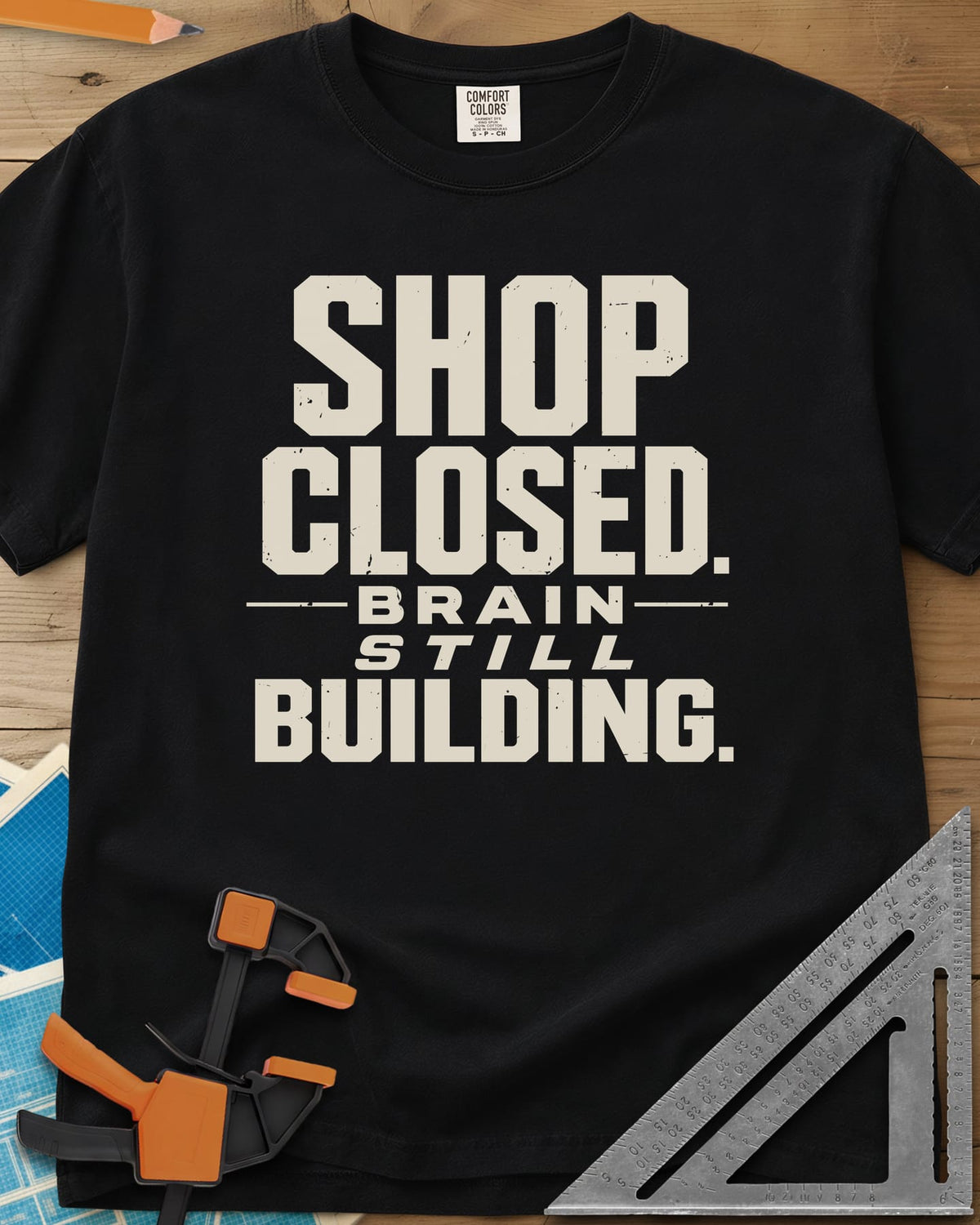 Brain Building heavyweight tee in Black, stacked block lettering with STILL in italics, no graphic
