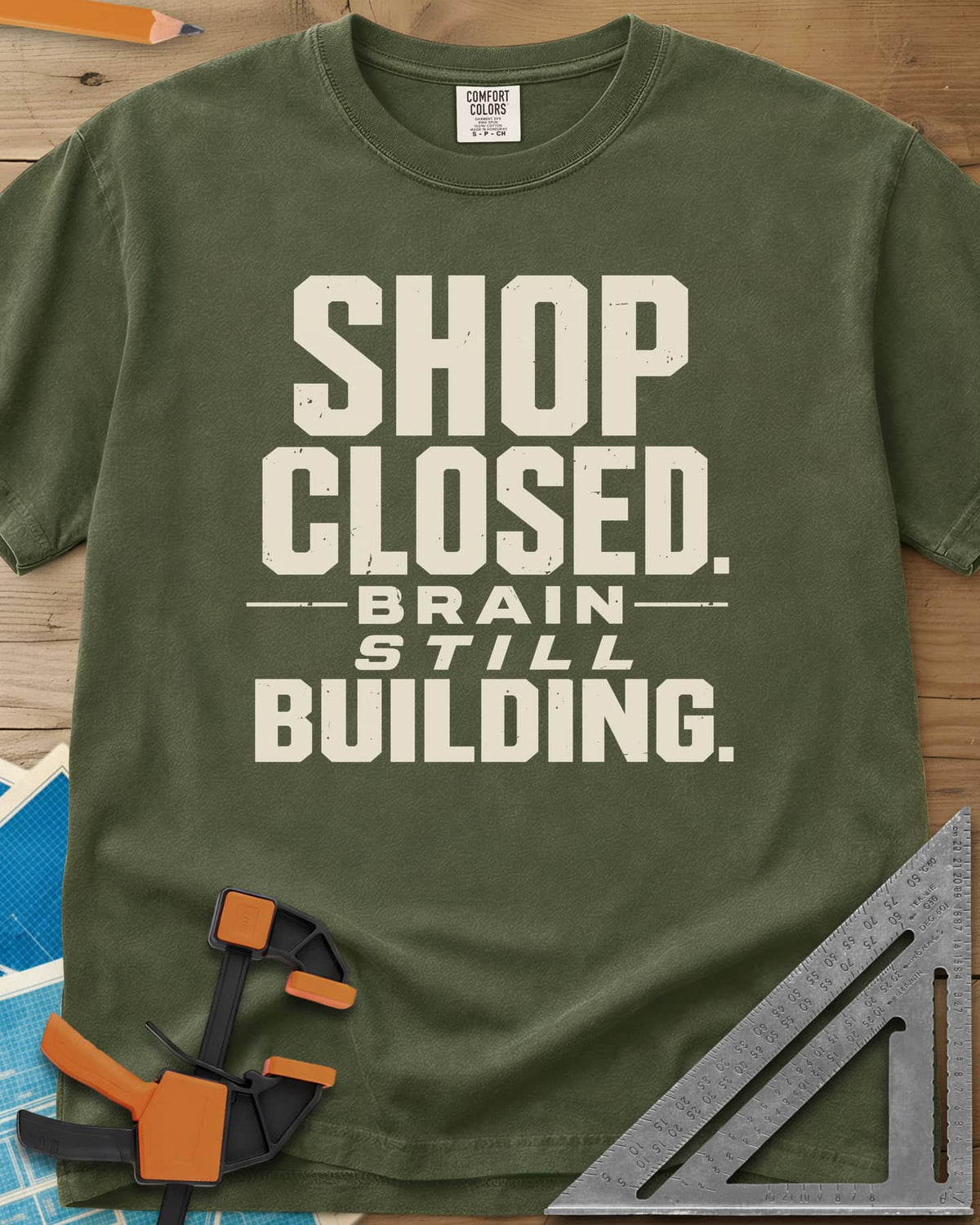 Brain Building heavyweight tee in Hemp, stacked block lettering with STILL in italics, no graphic