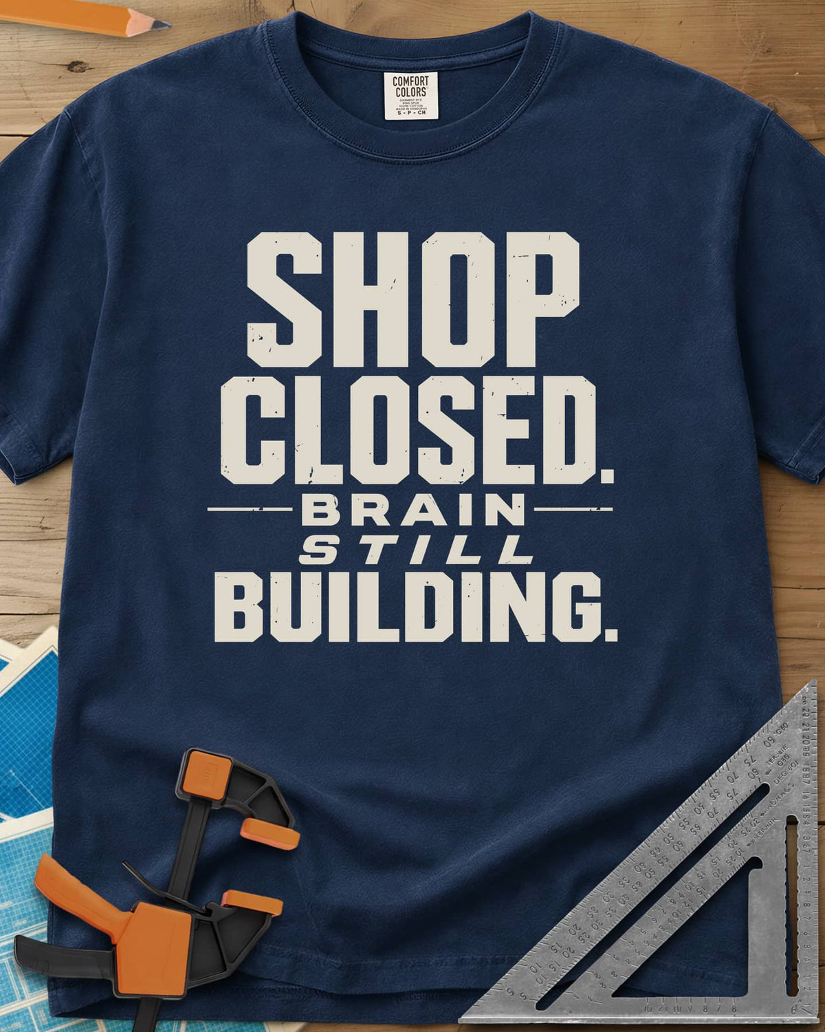 Brain Building heavyweight tee in Navy, stacked block lettering with STILL in italics, no graphic