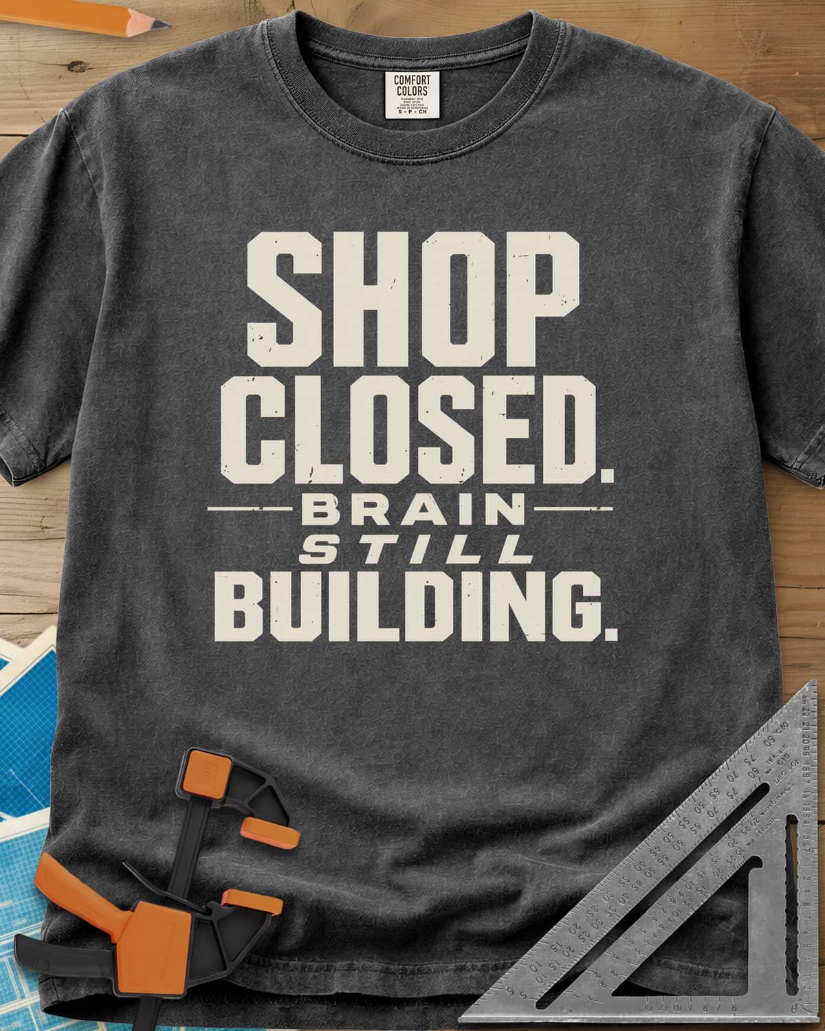 Brain Building heavyweight tee in Pepper, stacked block lettering with STILL in italics, no graphic