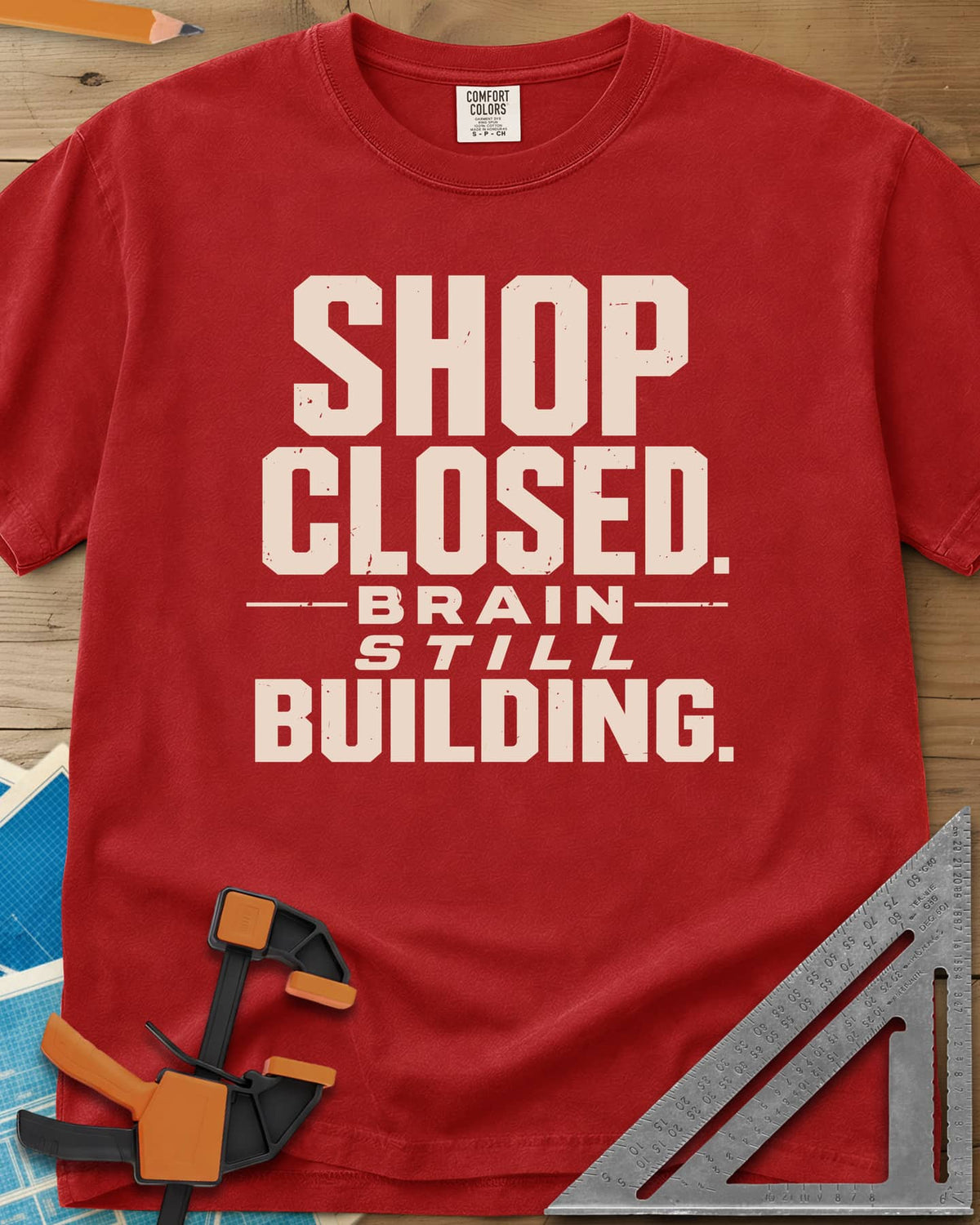 Brain Building heavyweight tee in Red, stacked block lettering with STILL in italics, no graphic
