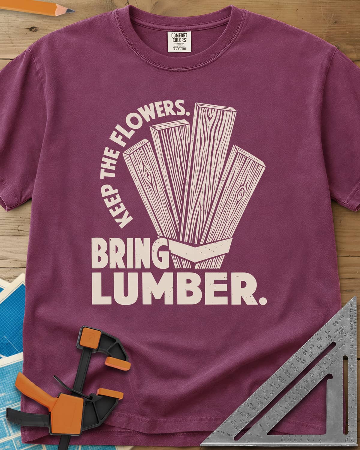 Bring Lumber heavyweight tee in Berry, four wood-grain boards fanned out like a bouquet