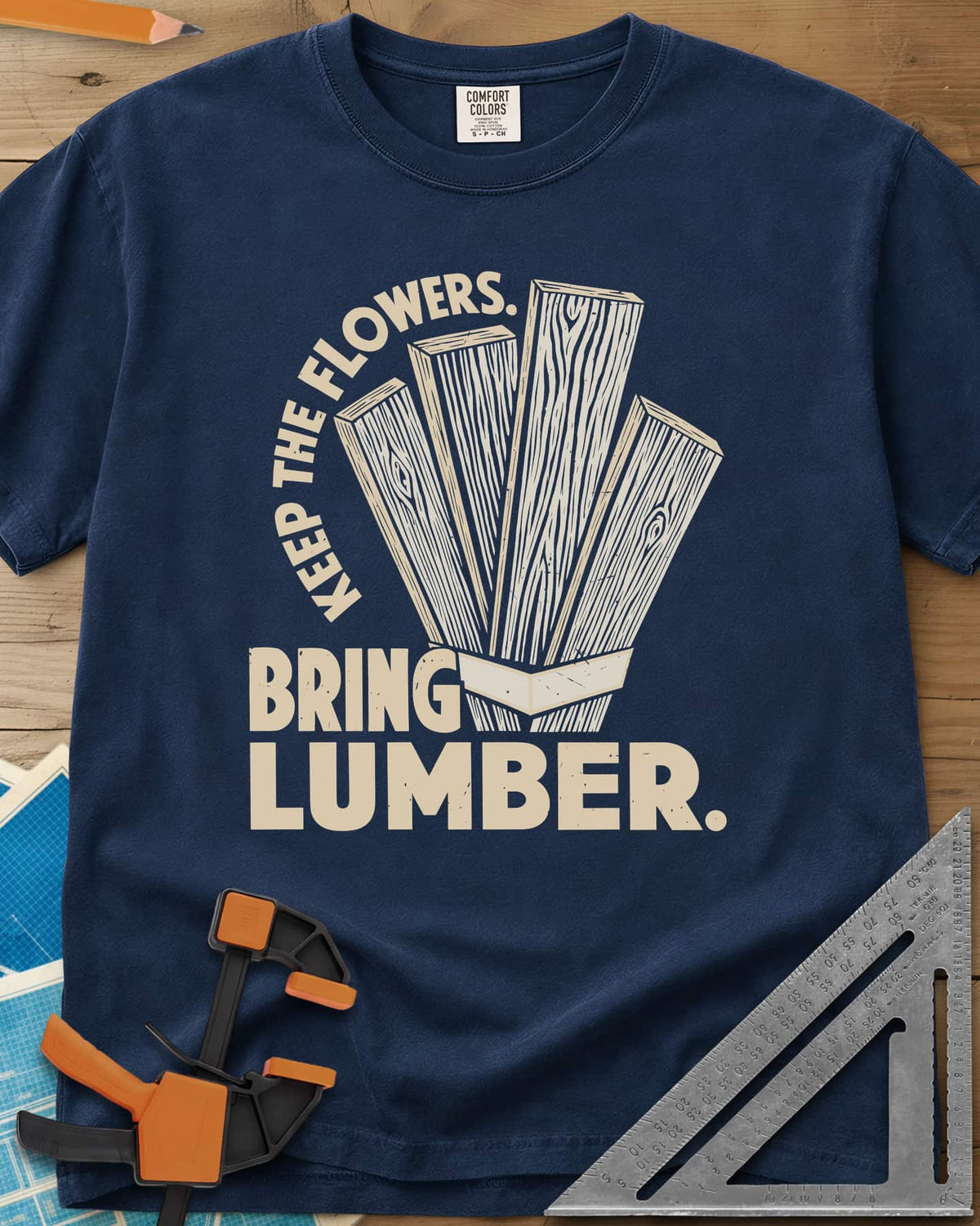Bring Lumber heavyweight tee in Navy, four wood-grain boards fanned out like a bouquet