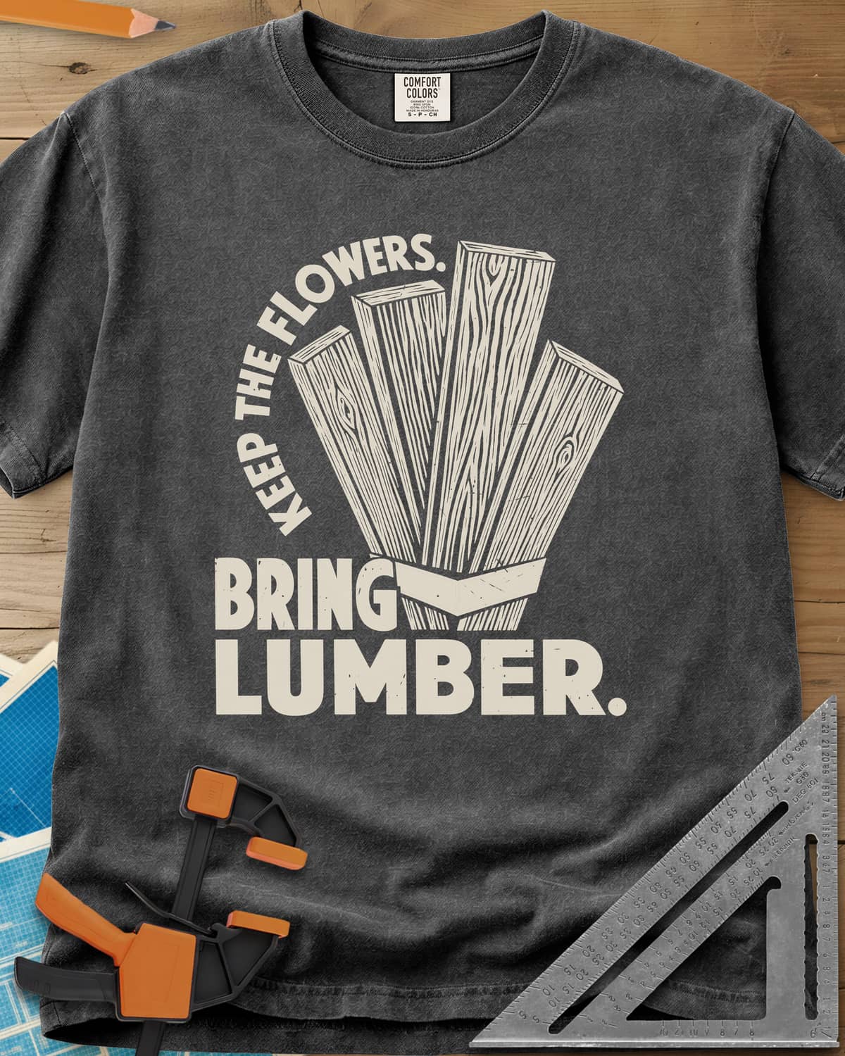 Bring Lumber heavyweight tee in Pepper, four wood-grain boards fanned out like a bouquet