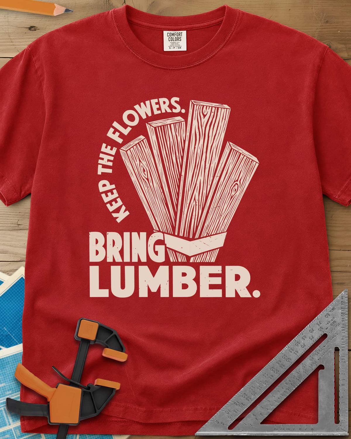 Bring Lumber heavyweight tee in Red, four wood-grain boards fanned out like a bouquet