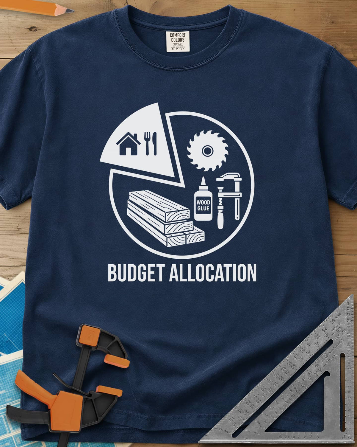 Budget Allocation heavyweight tee in Navy, pie chart: a small house and meal slice, the rest woodworking gear
