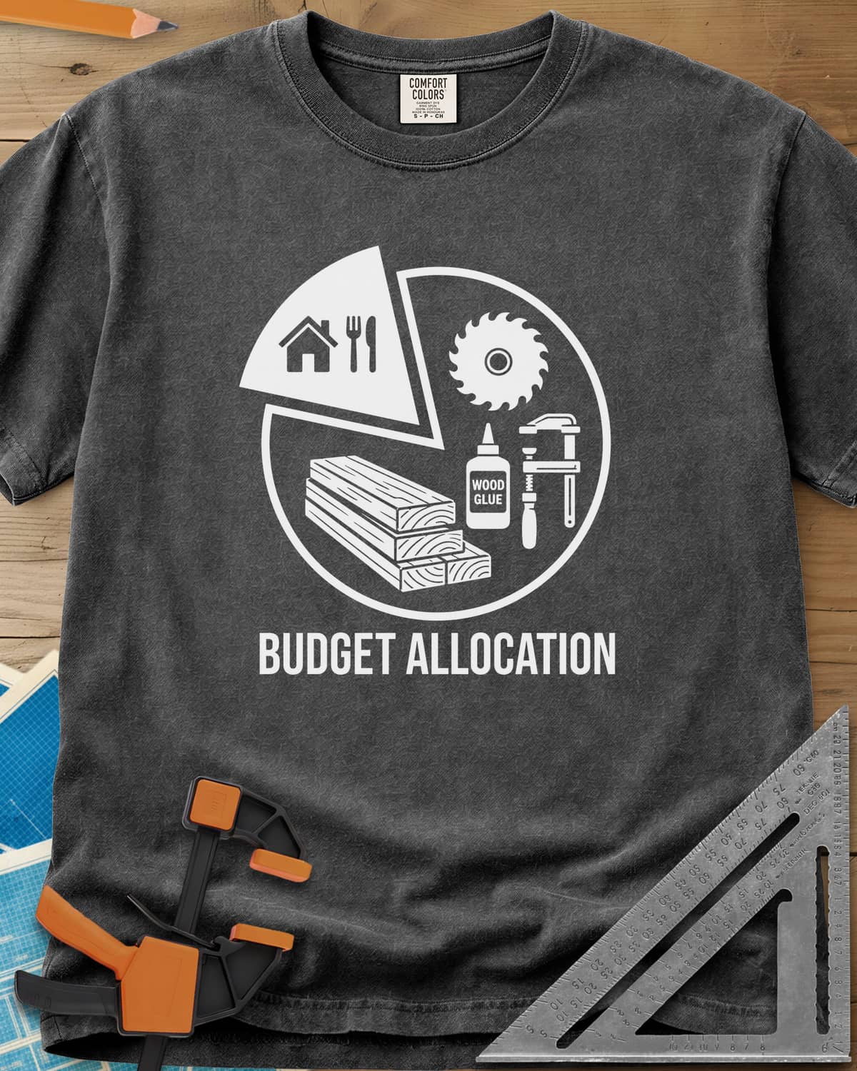 Budget Allocation heavyweight tee in Pepper, pie chart: a small house and meal slice, the rest woodworking gear