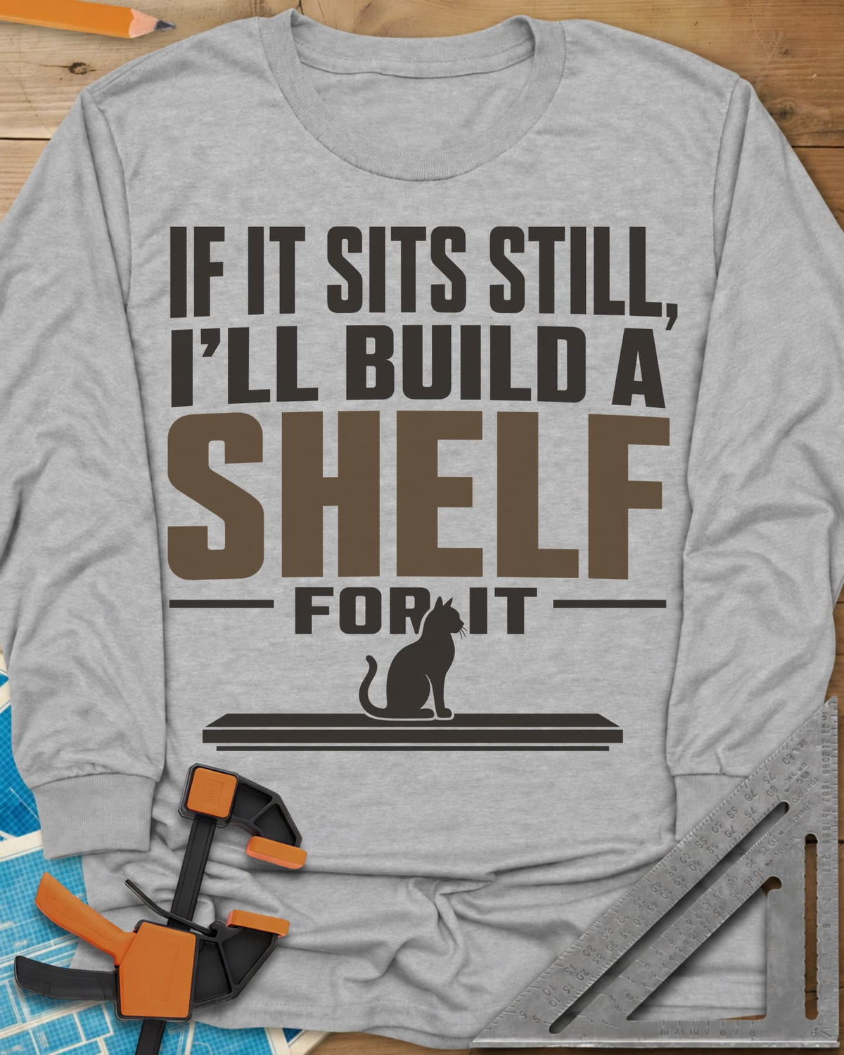 Build A Shelf long sleeve shirt in Sport Grey, a cat sitting on a plain shelf board under the words