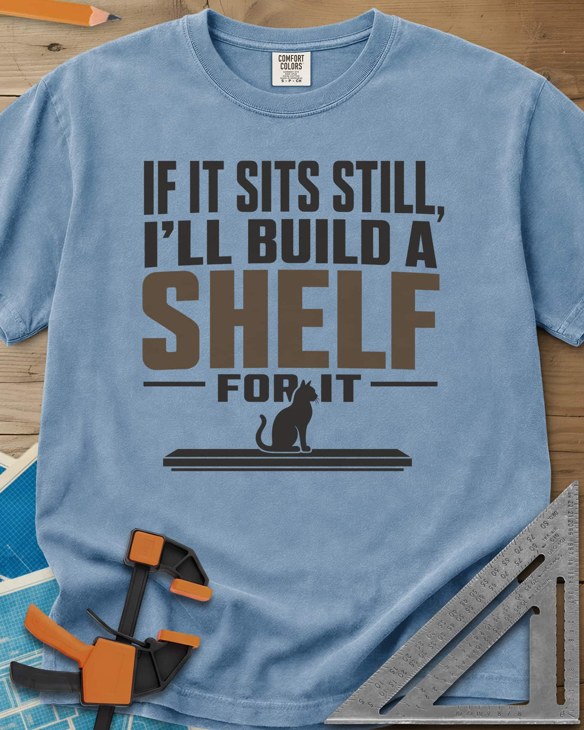 Build A Shelf heavyweight tee in Washed Denim, a cat sitting on a plain shelf board under the words