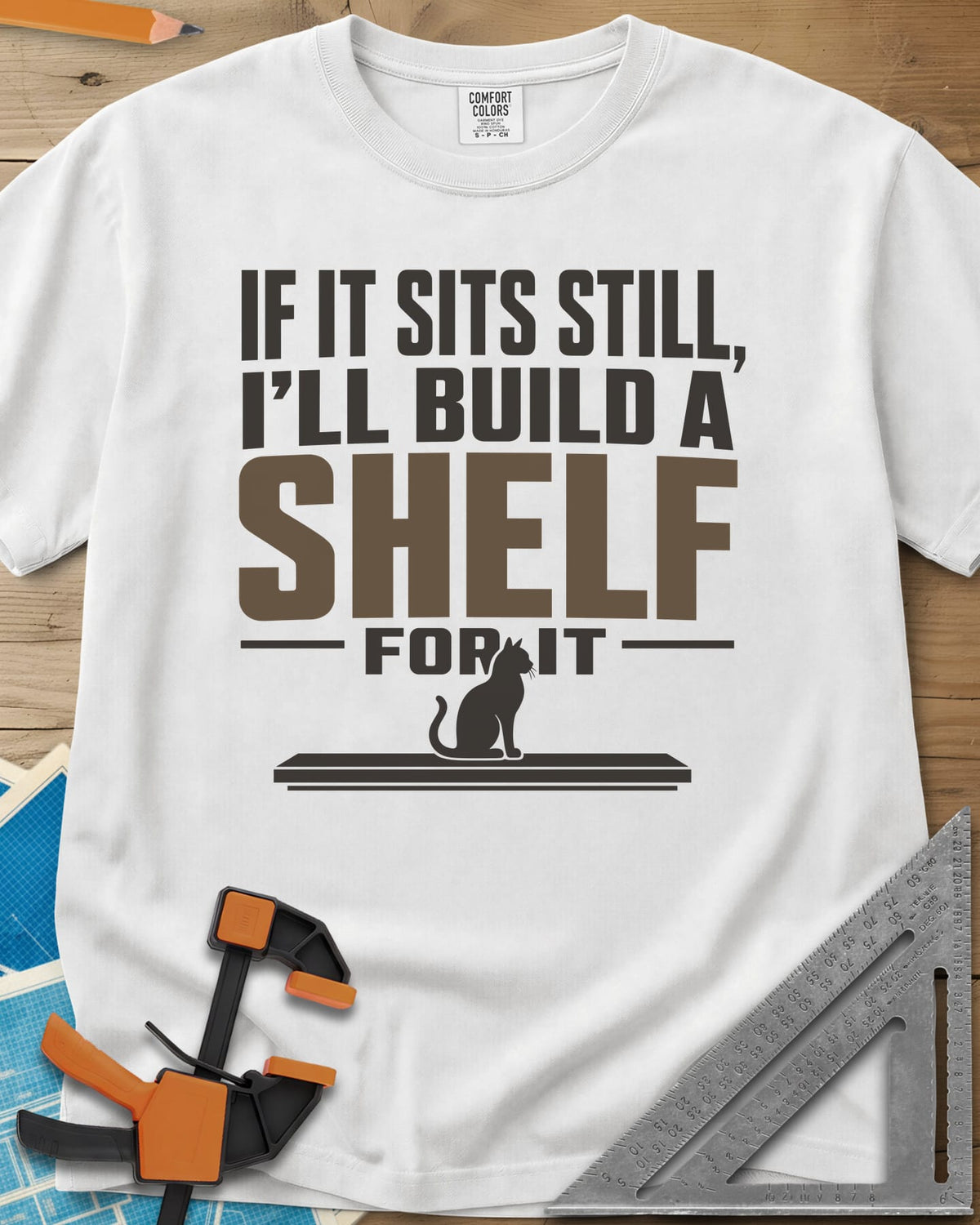 Build A Shelf heavyweight tee in White, a cat sitting on a plain shelf board under the words