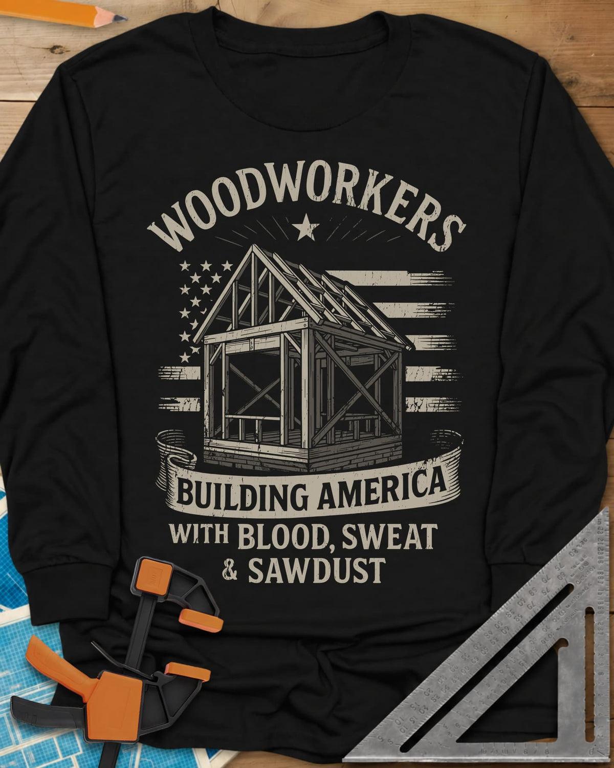 Building America long sleeve shirt in Black, a timber frame in front of a worn American flag