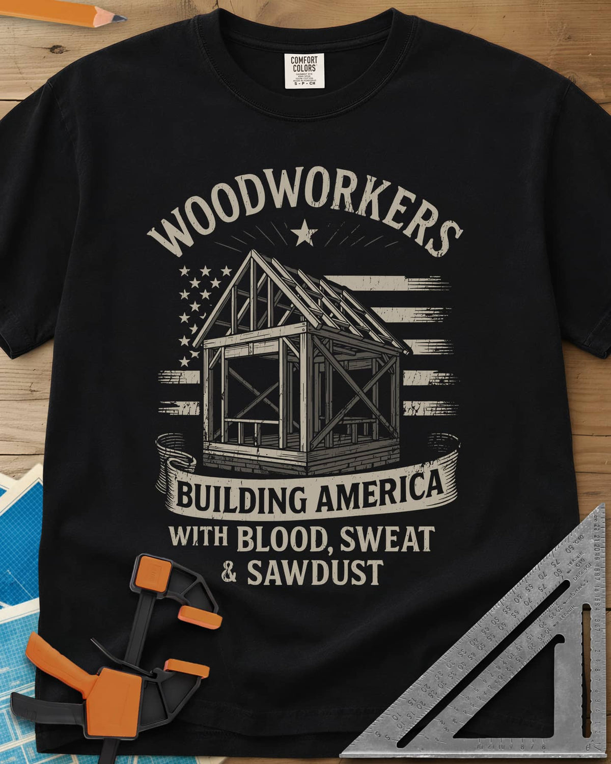 Building America heavyweight tee in Black, a timber frame in front of a worn American flag