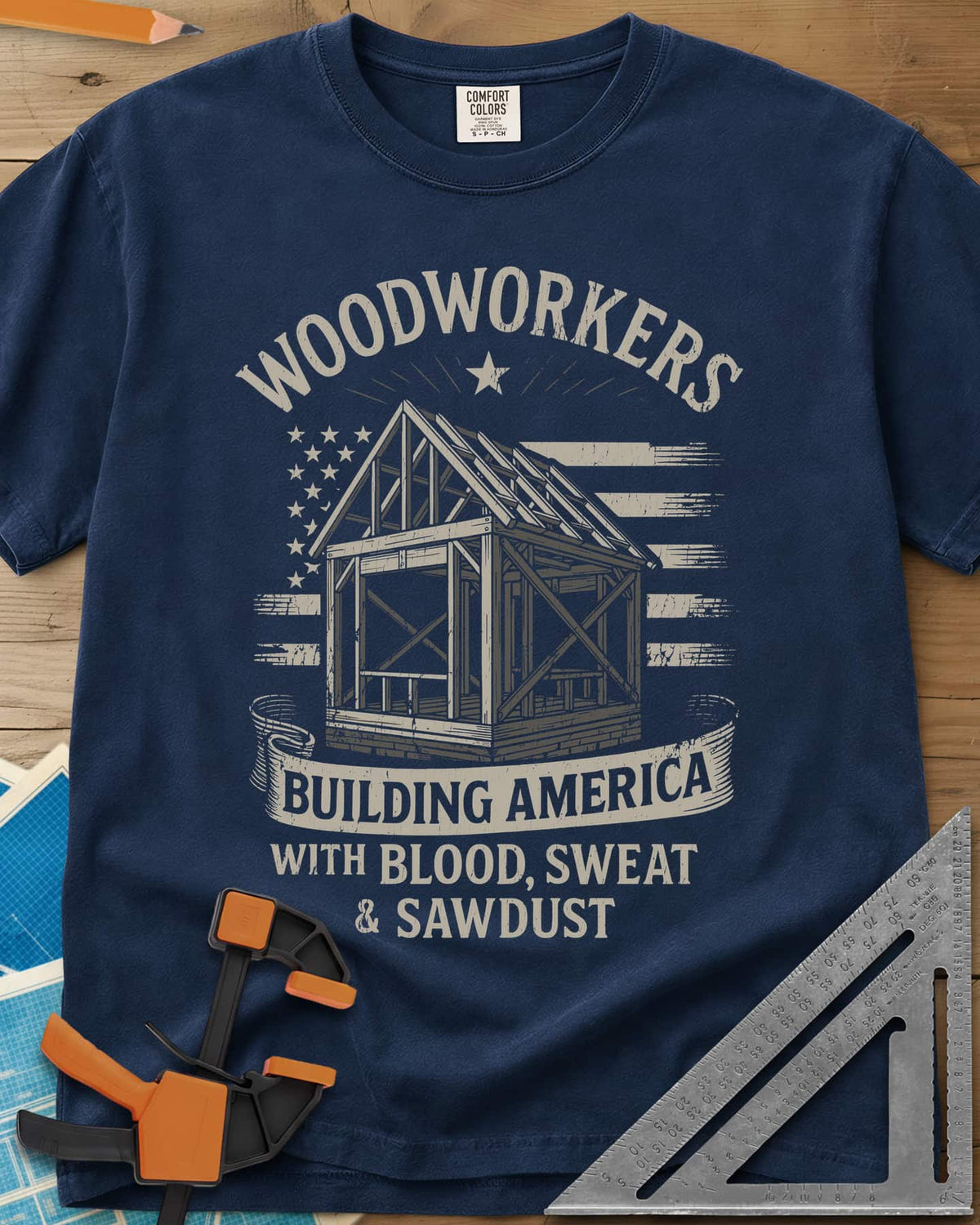 Building America heavyweight tee in Navy, a timber frame in front of a worn American flag