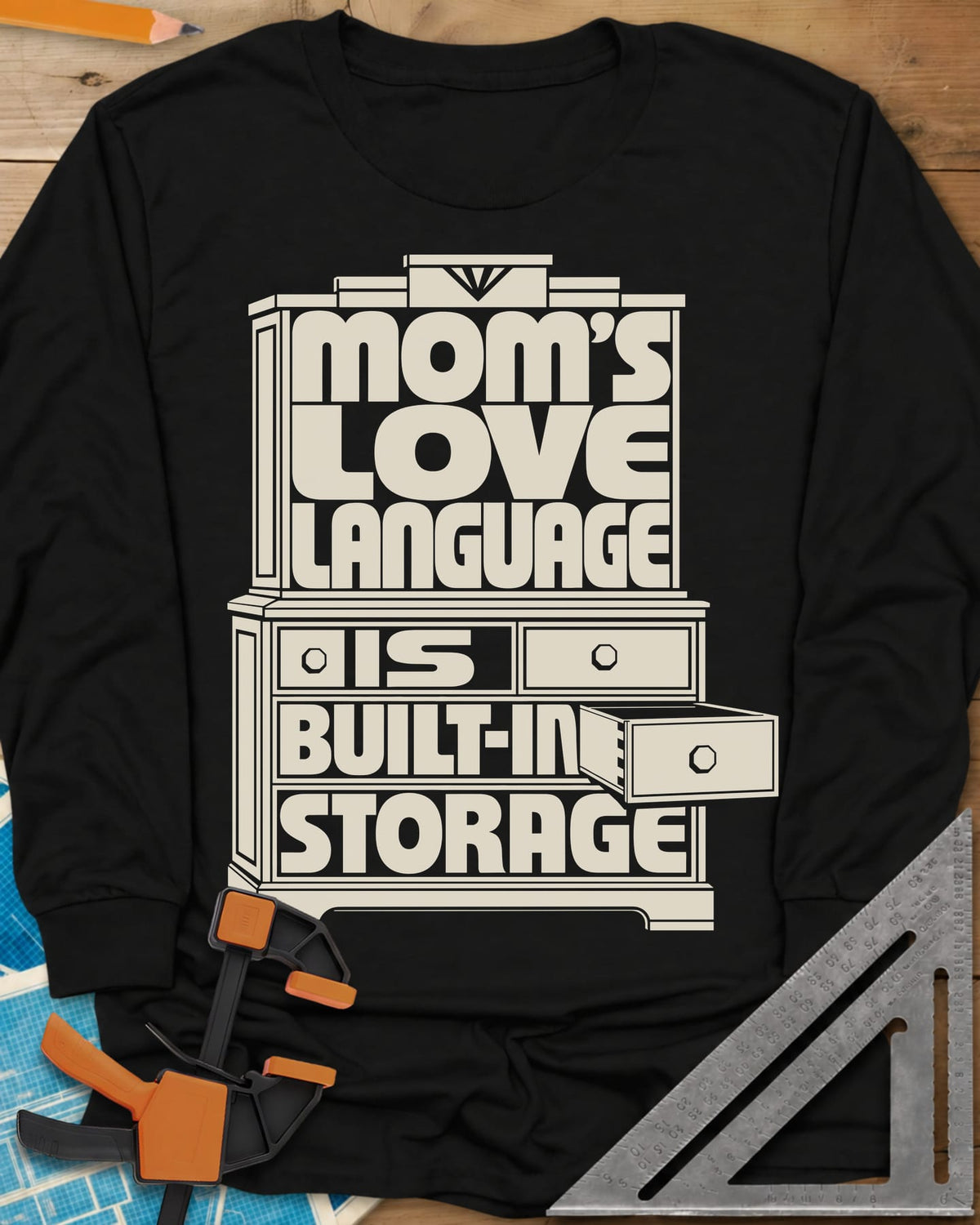 Built-In Storage long sleeve shirt in Black, block letters set inside a hutch outline with one drawer open
