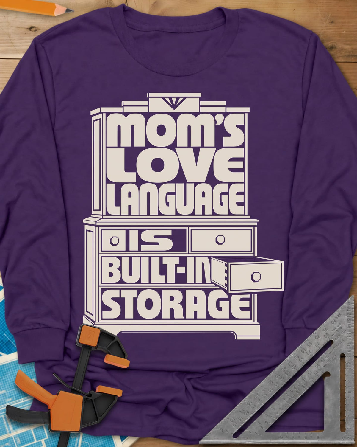 Built-In Storage long sleeve shirt in Purple, block letters set inside a hutch outline with one drawer open