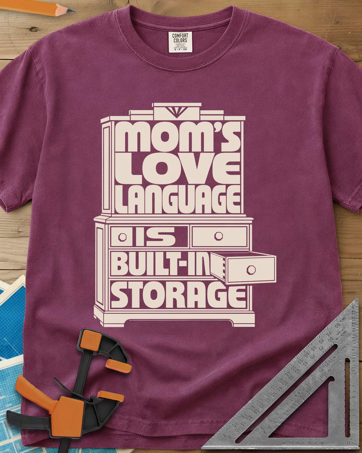 Built-In Storage heavyweight tee in Berry, block letters set inside a hutch outline with one drawer open