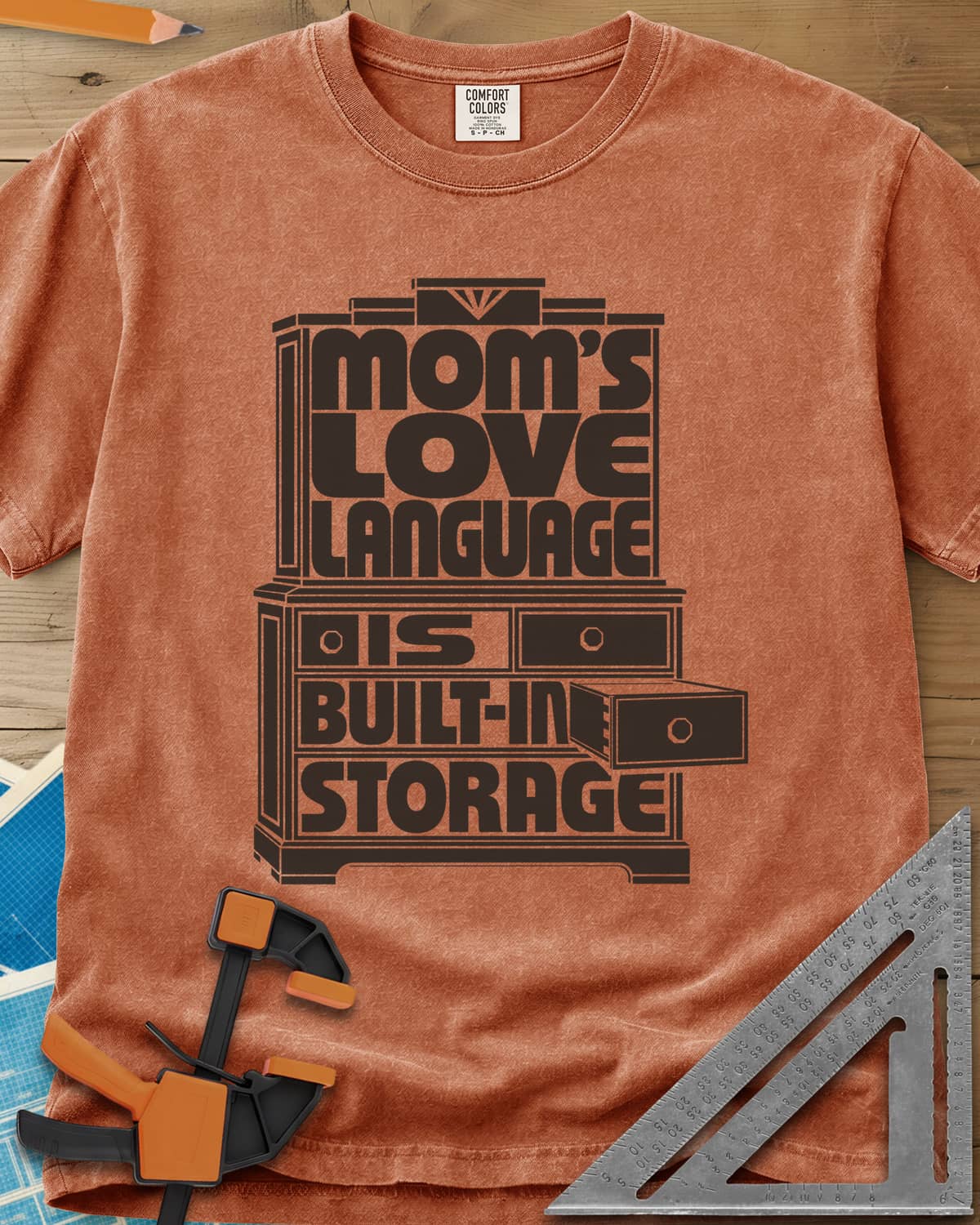 Built-In Storage heavyweight tee in Yam, block letters set inside a hutch outline with one drawer open