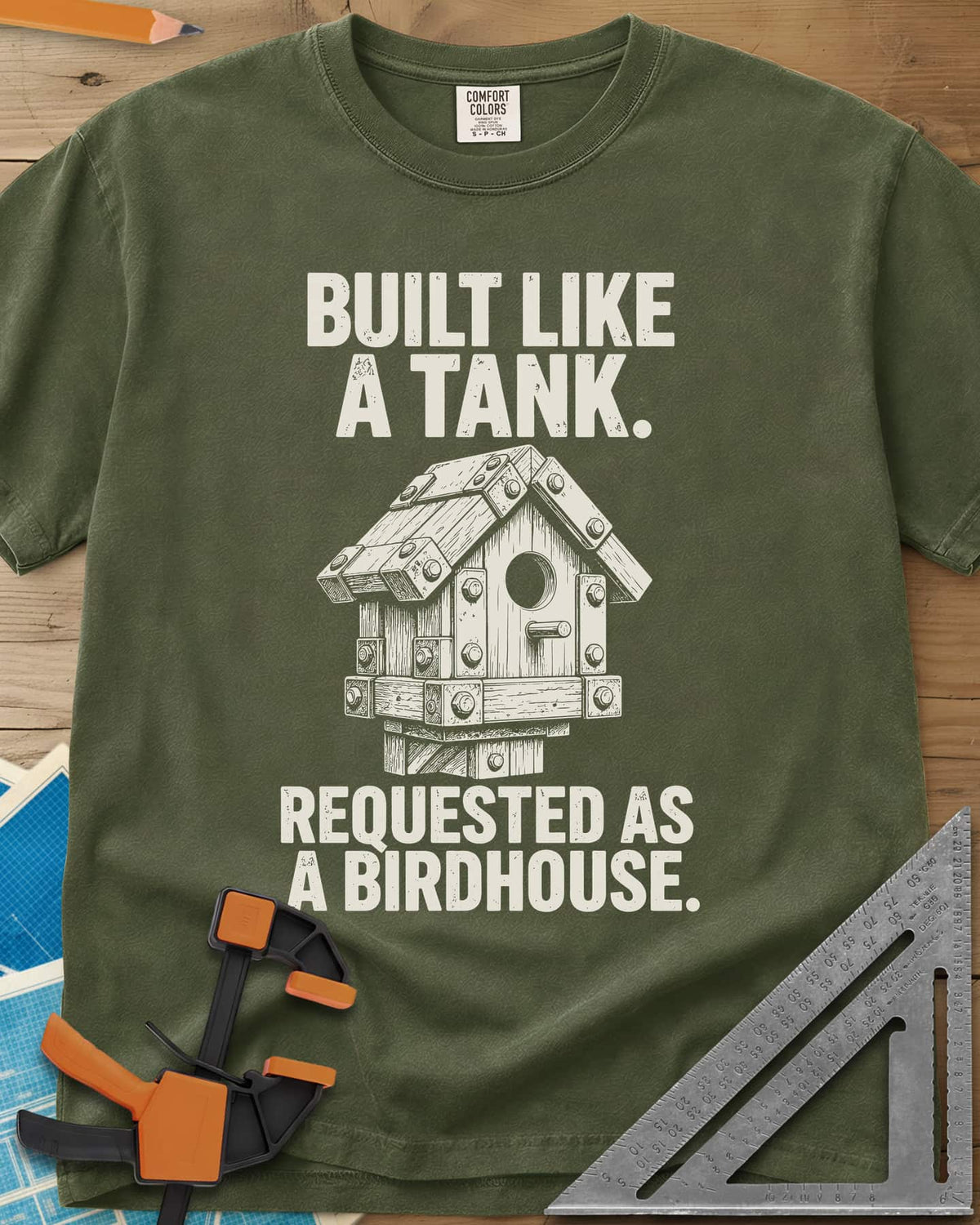 Built Like A Tank heavyweight tee in Hemp, a birdhouse armored with bolted plates and brackets