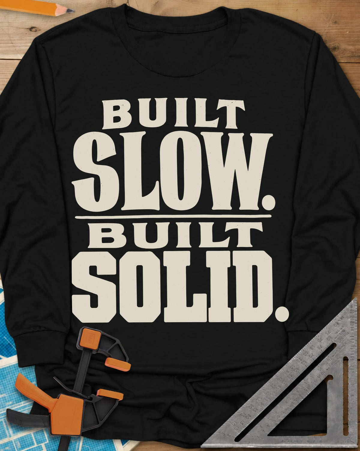 Built Solid long sleeve shirt in Black, bold stacked wood-type lettering, no graphic