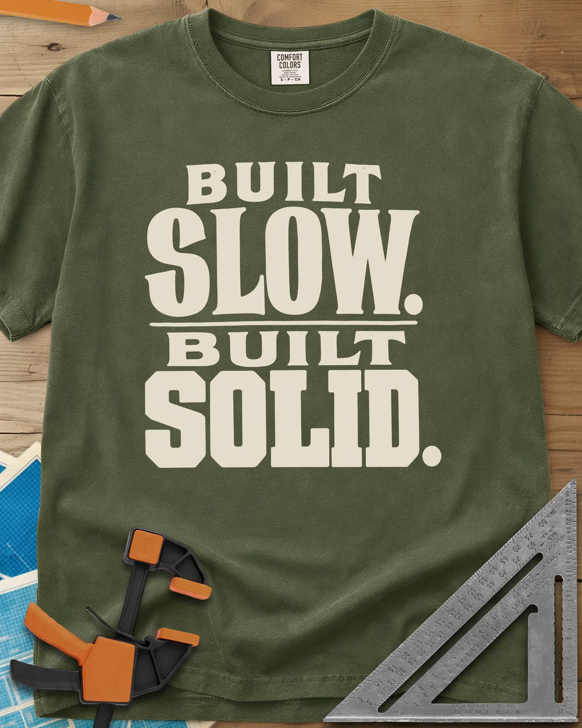 Built Solid heavyweight tee in Hemp, bold stacked wood-type lettering, no graphic