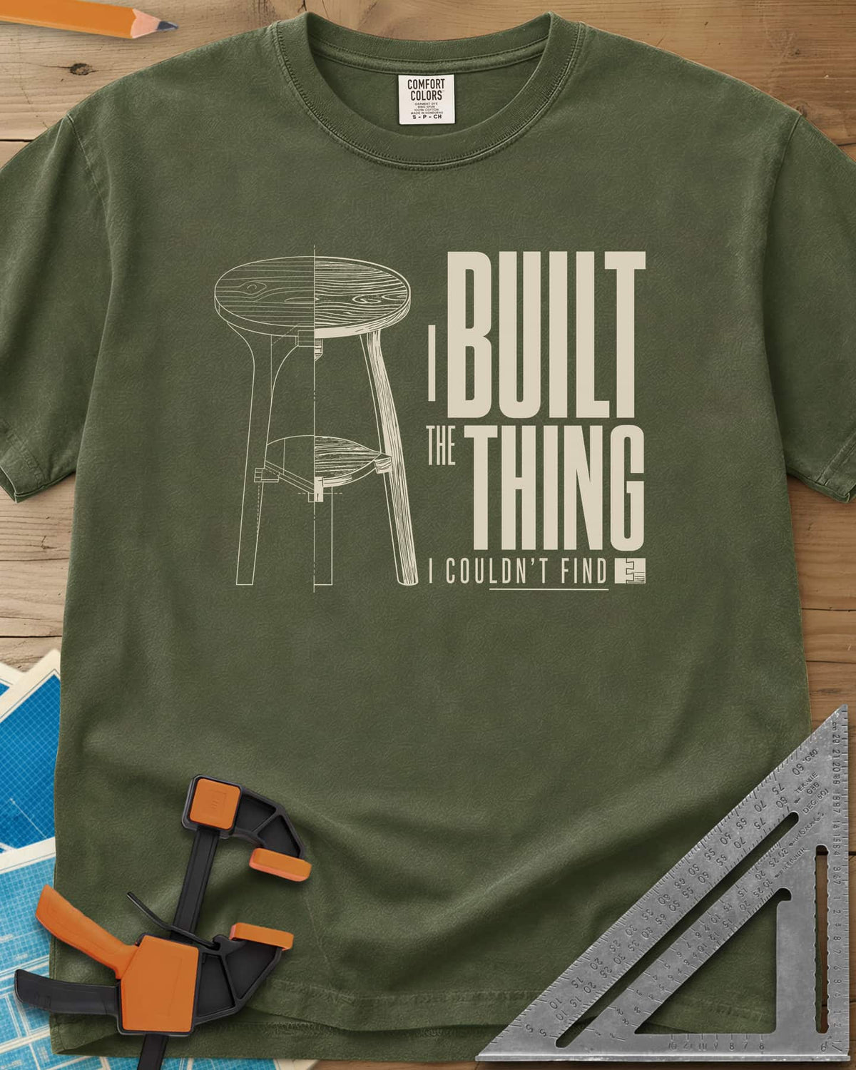 Built The Thing heavyweight tee in Hemp, a three-legged stool drawn half blueprint, half wood grain