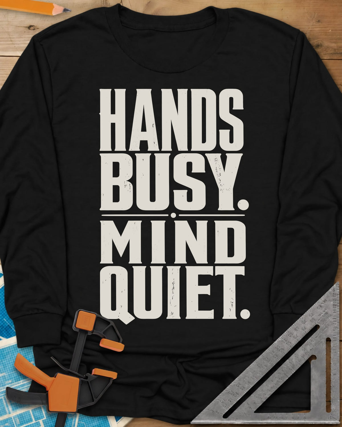 Busy Hands long sleeve shirt in Black, tall stacked block capitals with a dotted divider, no graphic