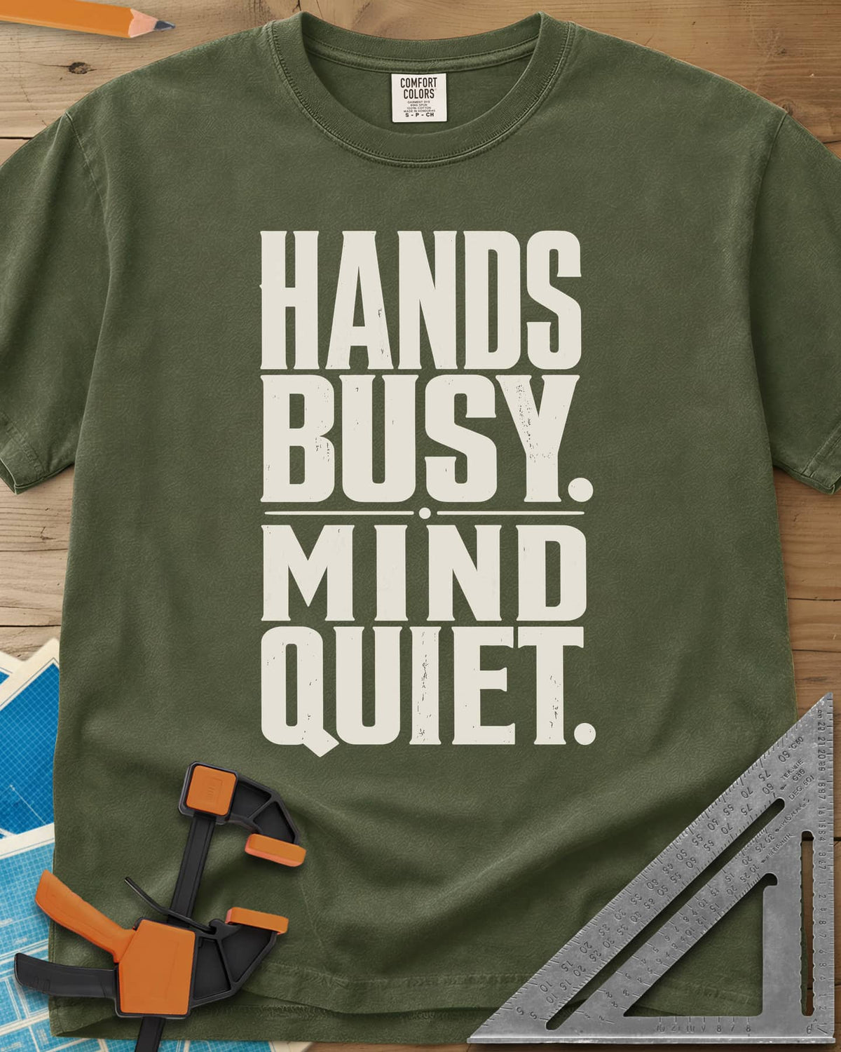Busy Hands heavyweight tee in Hemp, tall stacked block capitals with a dotted divider, no graphic