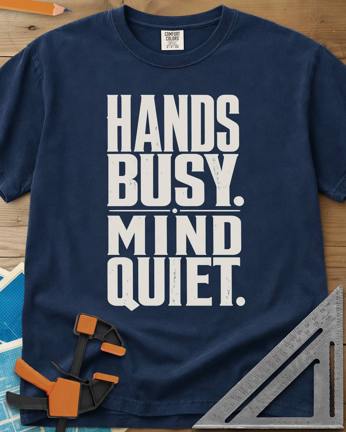 Busy Hands heavyweight tee in Navy, tall stacked block capitals with a dotted divider, no graphic