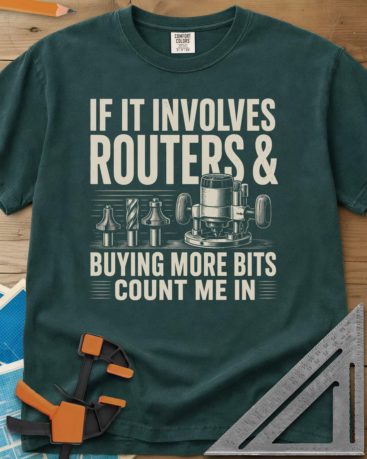 Buying More Router Bits heavyweight tee in Blue Spruce, an engraved plunge router with three router bits