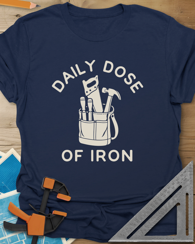 Daily Dose t-shirt in Navy, a canvas tool bag holding a handsaw, hammer and two chisels