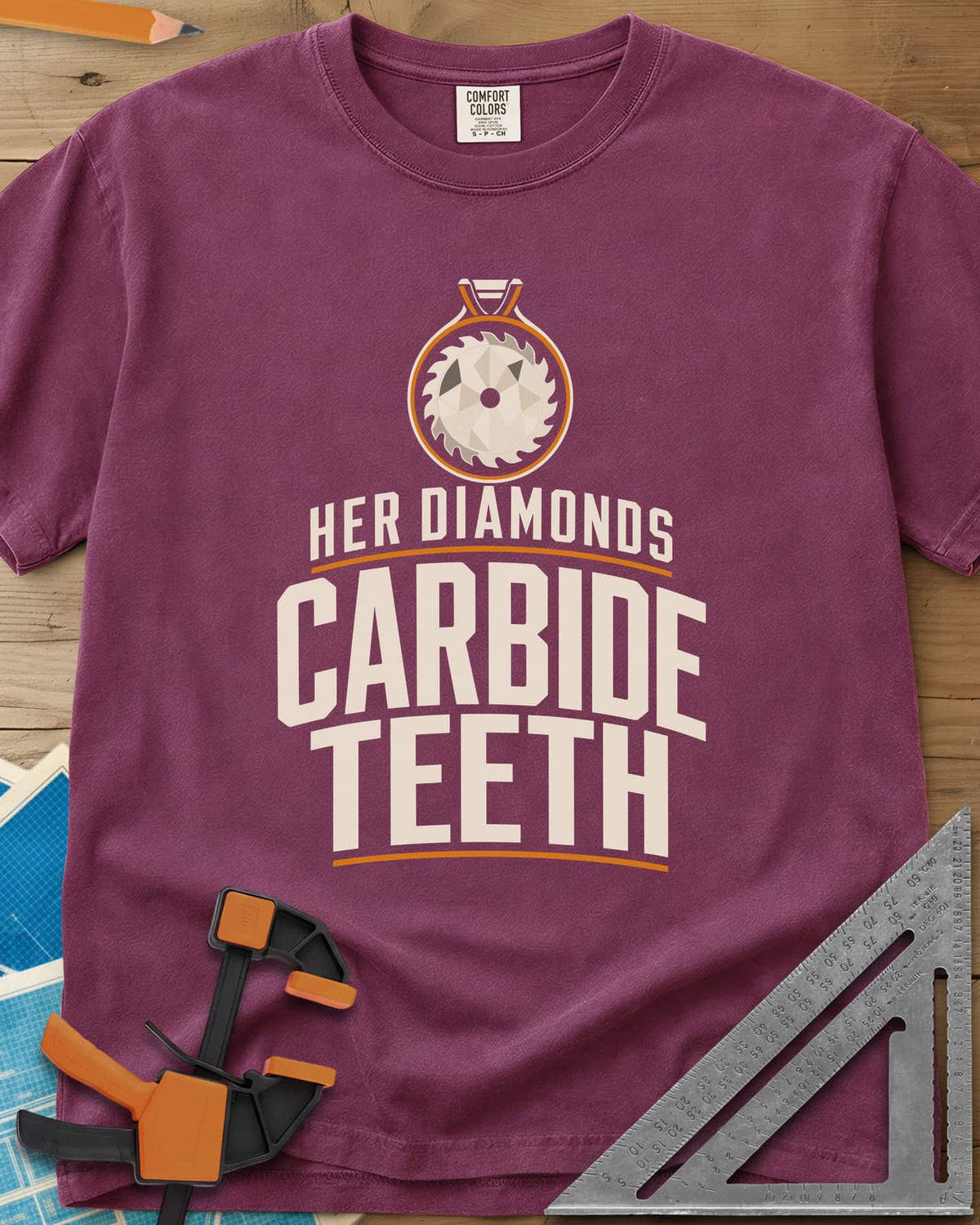Carbide Teeth heavyweight tee in Berry, a saw blade cut like a gemstone hanging as a pendant