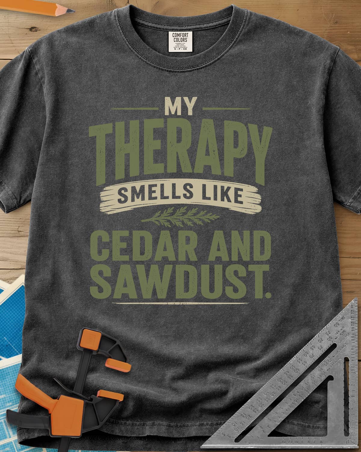 Cedar And Sawdust Therapy heavyweight tee in Pepper, bold lettering with a brush-stroke banner and a cedar sprig