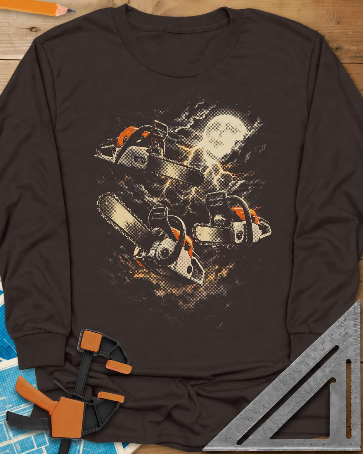Chainsaw After Dark long sleeve shirt in Dark Chocolate, three chainsaws floating under a full moon and lightning