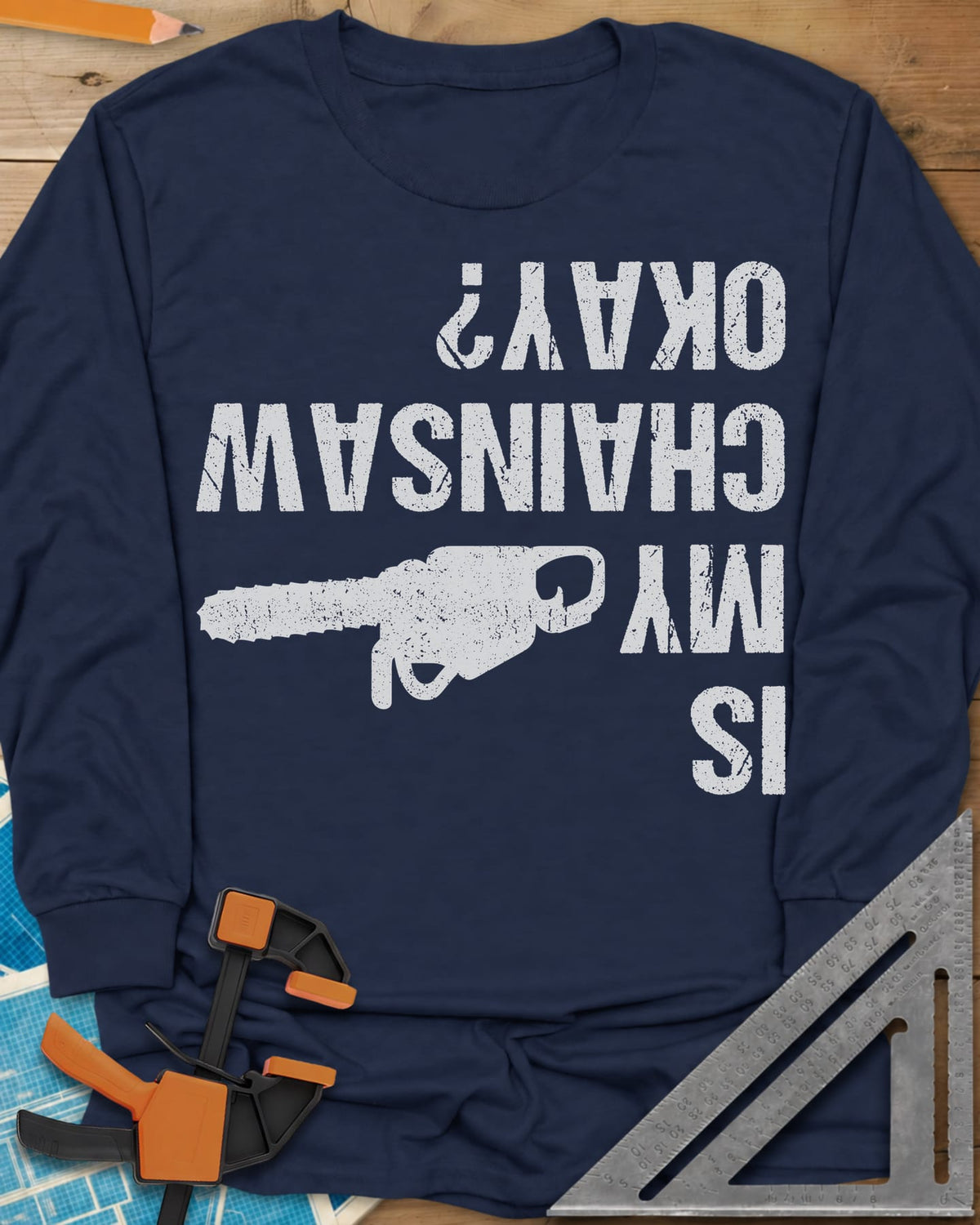 Chainsaw Okay? long sleeve shirt in Navy, upside-down distressed lettering beside a chainsaw on its side