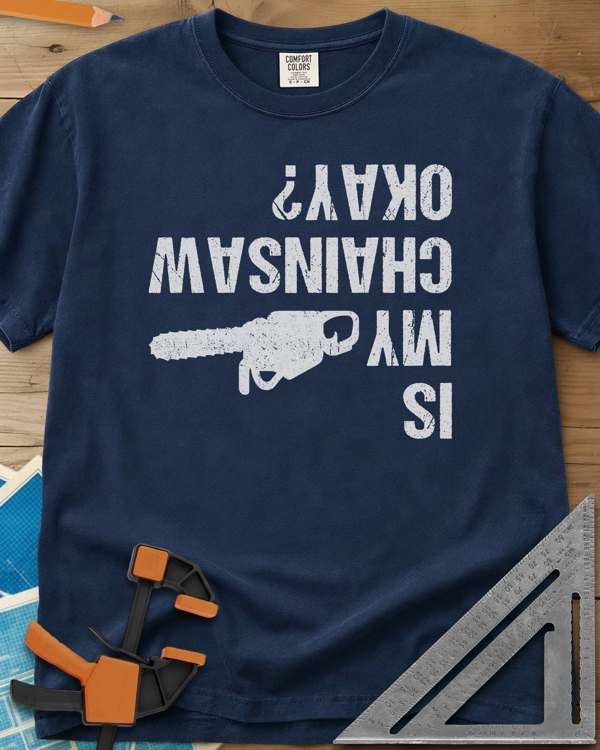 Chainsaw Okay? heavyweight tee in Navy, upside-down distressed lettering beside a chainsaw on its side