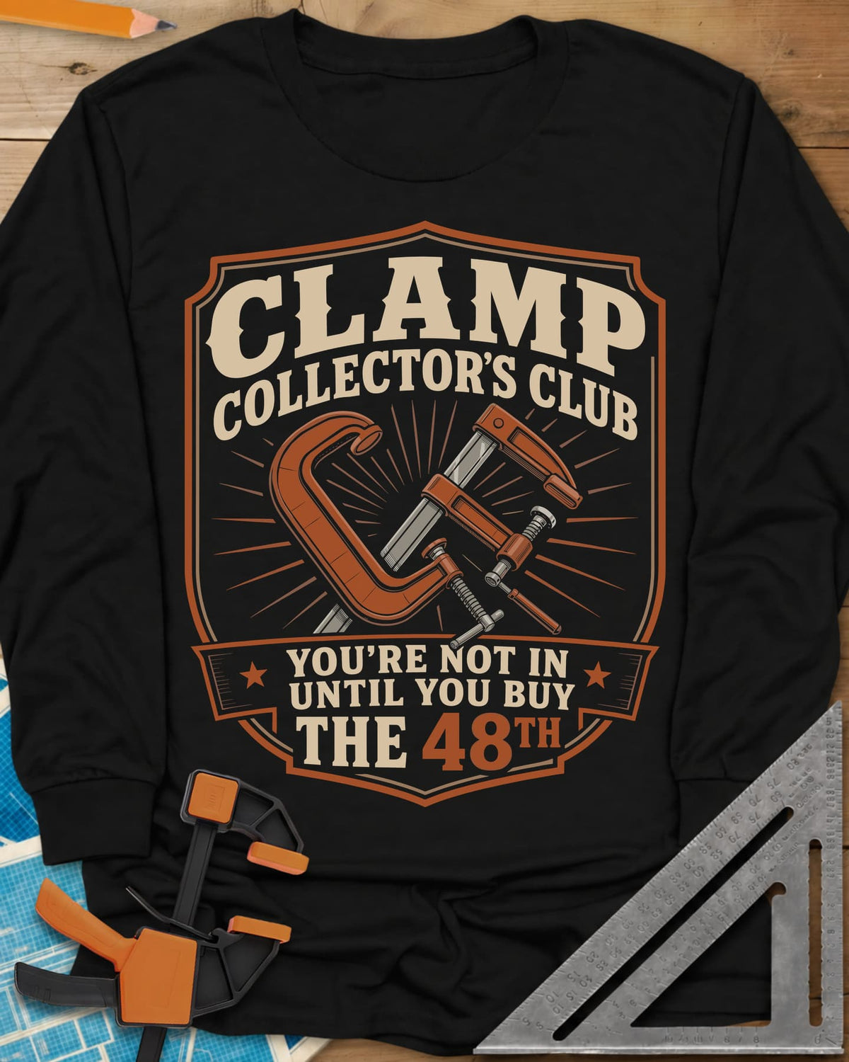 Clamp Collectors Club 48th long sleeve shirt in Black, a shield badge with a C-clamp and a bar clamp over a sunburst