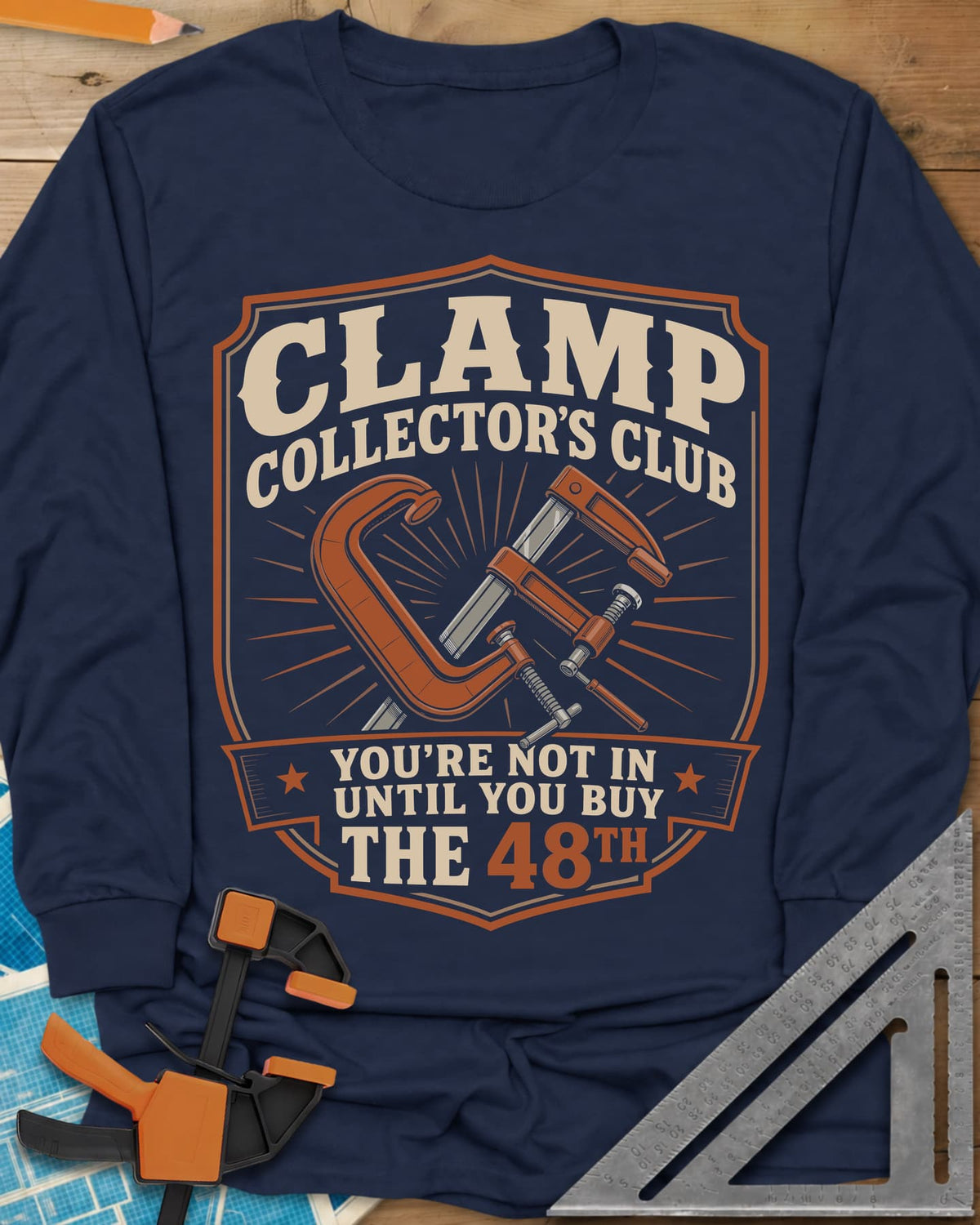 Clamp Collectors Club 48th long sleeve shirt in Navy, a shield badge with a C-clamp and a bar clamp over a sunburst