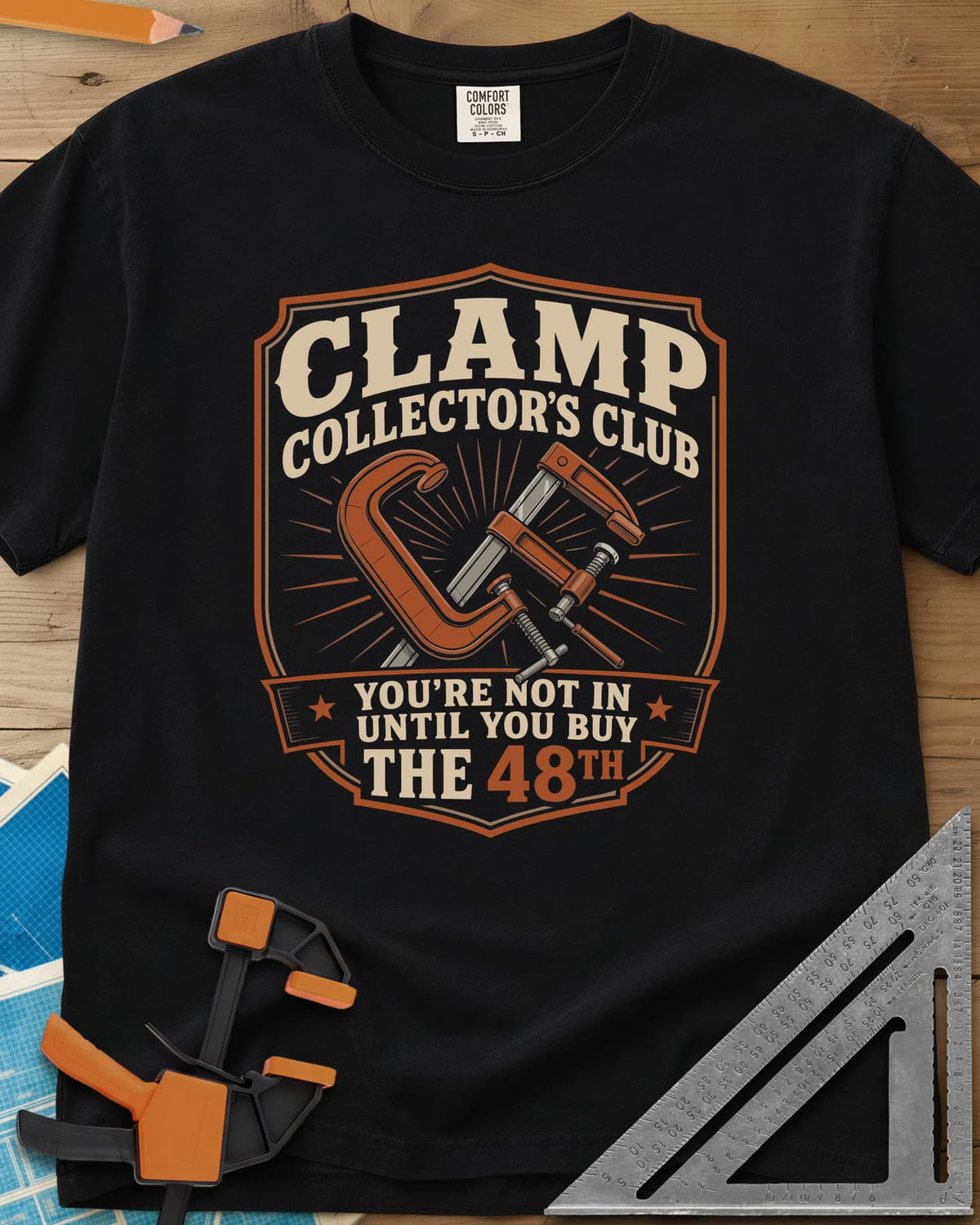Clamp Collectors Club 48th heavyweight tee in Black, a shield badge with a C-clamp and a bar clamp over a sunburst