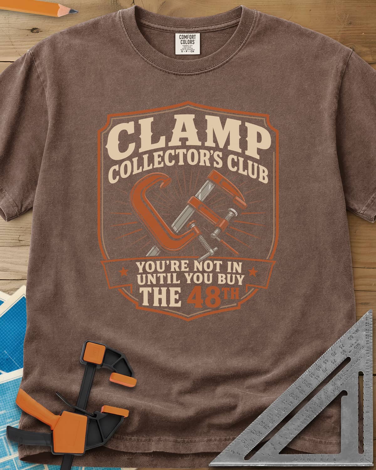 Clamp Collectors Club 48th heavyweight tee in Espresso, a shield badge with a C-clamp and a bar clamp over a sunburst