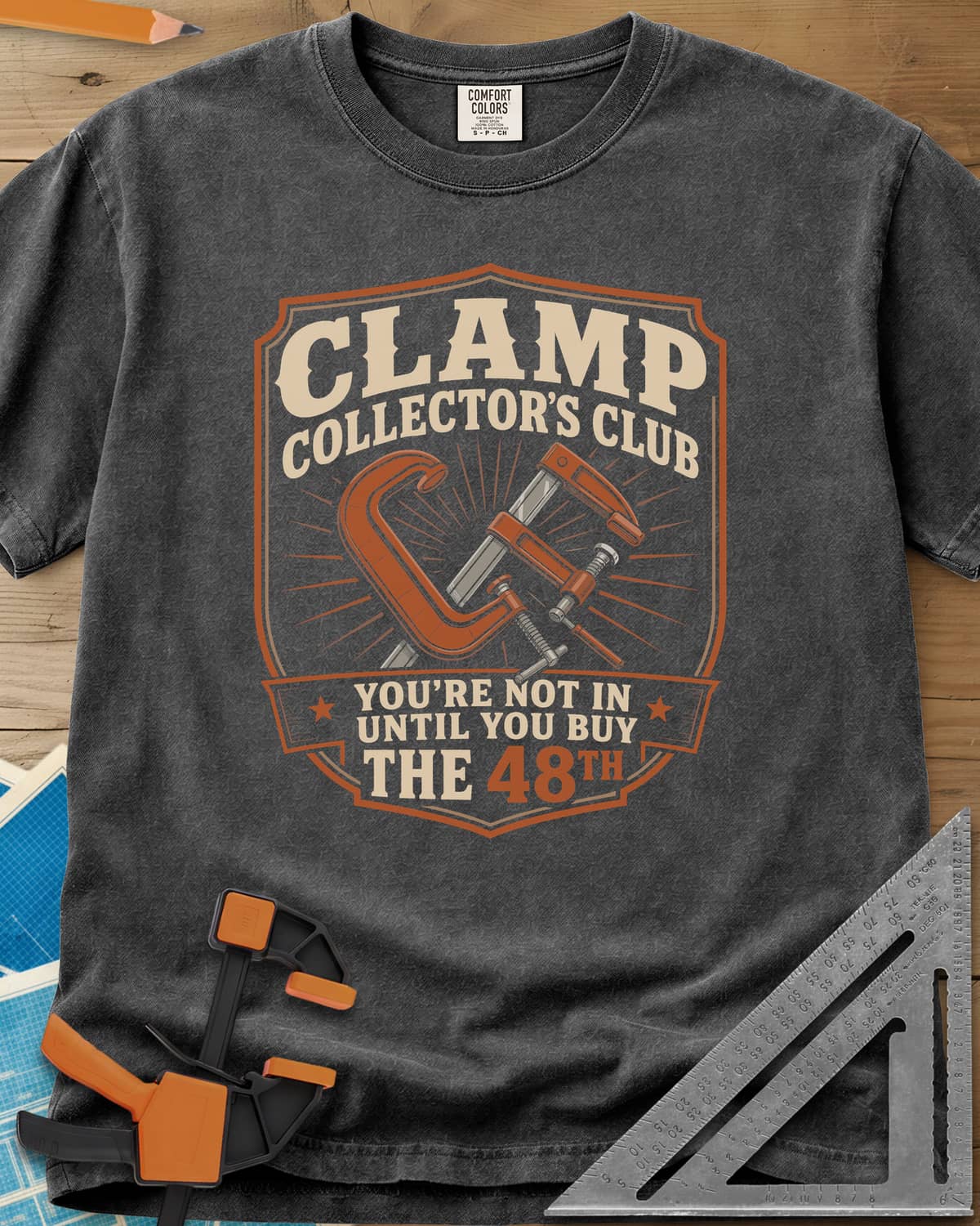 Clamp Collectors Club 48th heavyweight tee in Pepper, a shield badge with a C-clamp and a bar clamp over a sunburst